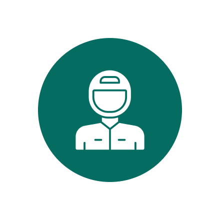A person with a helmet on in a green circle.